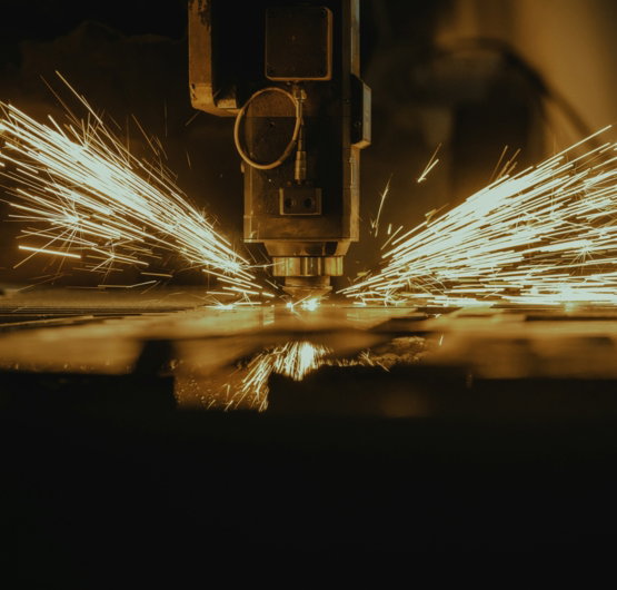 a piece of metal being cut with a machine